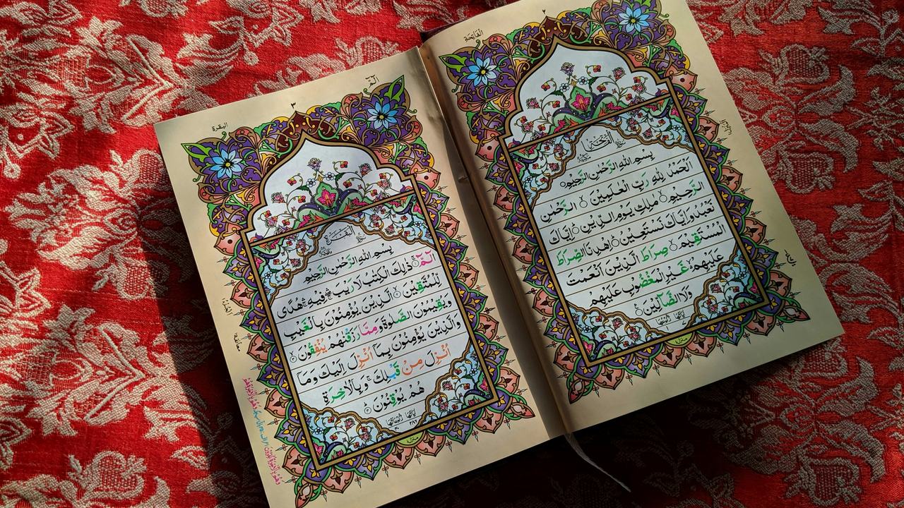 An open Qur'an showing Surah Al-Fatihah