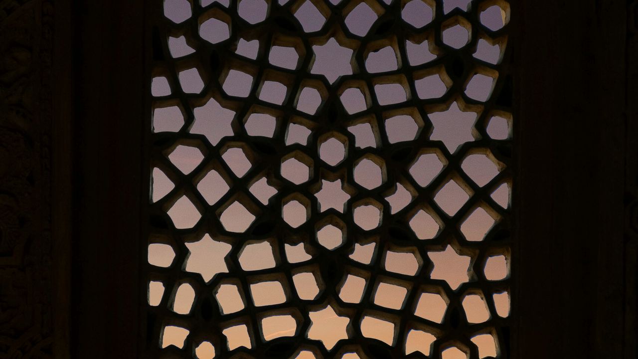 Soft light through a patterned mosque window