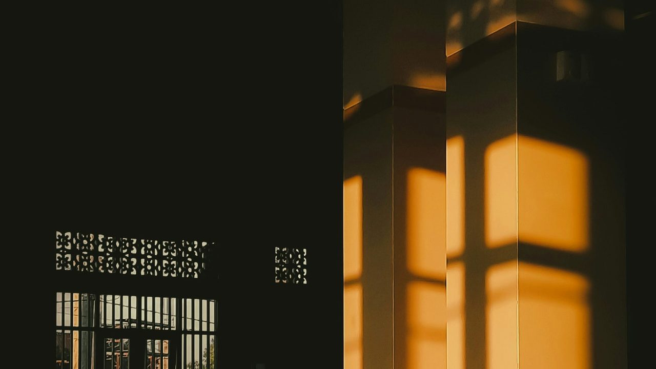 Warm light falling through an open doorway in a quiet room